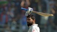 India's Murali Vijay celebrates after scoring a century on the third day of the fourth Test match between India and England at the Wankhede stadium in Mumbai on December 10, 2016. GETTYOUT / AFP / Punit PARANJPE 