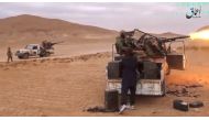 A still image taken on December 11, 2016 from a video released by Islamic State-affiliated Amaq news agency on December 10, 2016, purports to show Islamic State fighters advancing over the Hayan mountain south of Palmyra. 