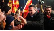 Zoran Zaev (C), the leader of the oppositional Social Democratic Union of Macedonia (SDSM) party, greets his supporters during their last election rally in Skopje on December 9, 2016 ahead of parlamentary elections to be held on 11 December. Robert ATANAS