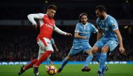 Arsenal's Alex Oxlade-Chamberlain in action with Stoke City's Joe Allen and Erik Pieters Reuters / Clodagh Kilcoyne 