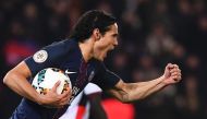 Paris Saint-Germain's Uruguayan forward Edinson Cavani celebrates after scoring a goal during the French L1 football match between Paris Saint-Germain and Nice at the Parc des Princes stadium in Paris on Deecmber 11, 2016. / AFP / FRANCK FIFE
