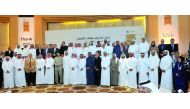 Dr Hassan Al Derham (first row, ninth left), President of Qatar University, with other officials and various company representatives during the Employer Recognition Ceremony held at Al Ghassar Ballroom yesterday. Pic: Kammutty VP/ The Peninsula
