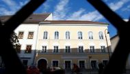 The house in which Adolf Hitler was born is seen through a fence in the northern Austrian city of Braunau am Inn September 24, 2012. REUTERS/Dominic Ebenbichler/File Photo