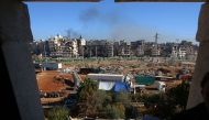 Buses which will be used to evacuate rebel fighters and their families from rebel-held areas of Aleppo are seen waiting on December 15, 2016. Russia, Syrian military sources and rebel officials confirmed that a new agreement had been reached after a first