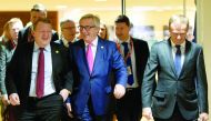 Danish Prime Minister Lars Lokke Rasmussen (left) walks with European Commission President Jean-Claude Juncker (centre) and European Council President Donald Tusk to a meeting regarding Europol in Brussels.