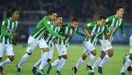 Players of Atletico Nacional celebrate their win over Club America following their penalty kick shootout at the Club World Cup third-place playoff football match between Atletico Nacional of Colombia and Club America of Mexico at Yokohama International st