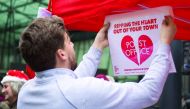 A member of the Communication Workers Union (CWU) takes part in a picket outside the Department for Business, Innovation and Skills in London yesterday.