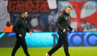 Leipzig's Austrian head coach Ralph Hasenhuettl (R) celebrates next to Herth's Hungarian head coach Pal Dardai after winning during the German first division Bundesliga football match between RB Leipzig and Hertha BSC Berlin in Leipzig, eastern Germany on