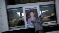 A woman holds the photograph of a relative lost in fight between drug gangs during a serach at Escobedo on the outskirts of Monterrey, Mexico, August 12, 2016 (REUTERS) 