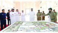 Deputy Emir H H Sheikh Abdullah bin Hamad Al Thani being briefed on the model of new buildings, at the Emiri Guard premises yesterday.