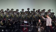 (FILES) This file photo taken on October 23, 2015 shows the official army choir of the Russian armed forces, also known as the Alexandrov Ensemble, standing while the choir conductor General Viktor Eliseev (R) arrives onstage at the Palais des Sports in P