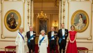 The Duchess of Cornwall, the Prince of Wales, Queen Elizabeth II, the Duke of Edinburgh, and Duke and Duchess of Cambridge (L-R) arrive for the annual evening reception for members of the Diplomatic Corps at Buckingham Palace in London, Britain December 8