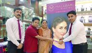 Ajit Aby John, one of the lucky winners of ‘Malabar Gold & Diamonds Festival’ receives ‘100 % Cash Back’ from Shaffi, Assistant Manager, in the presence of other officials from Malabar Gold & Diamonds, at Gharafa Lulu branch.