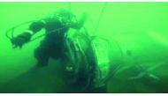 A diver looking at a piece of the crashed military plane during searches in the Black Sea outside Sochi, yesterday.