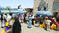 Beneficiaries taking water from a project set-up by RAF in Yemen.