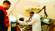 A patient being treated using the high-tech medical equipment procured by QRCS at a cost of $150,000.