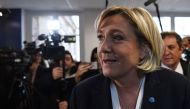 Marine Le Pen, leader of the French far-right Front National (FN) party, leaves after delivering her New Year's wishes to the press in Paris on January 4, 2017. / AFP / ALAIN JOCARD
