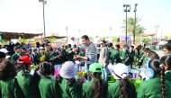 Students visiting Mahaseel Festival attend a session on growing flowering plants, yesterday.