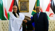President of the Saharawi Arab Democratic Republic Brahim Ghali (L) is welcomed by South African President Jacob Zuma (R) during an official visit to South Africa on January 6, 2016 at the Presidential Guest House in Pretoria. AFP / PHIL MAGAKOE