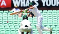 Pakistani batsman Younis Khan hits the ball past Australian fielder Peter Handscomb on the fourth day of the third Test at the SCG, in Sydney yesterday.