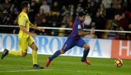 Barcelona's Luis Suarez (R) and Villarreal's Victor Ruiz in action. (REUTERS/Heino Kalis)