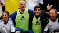Diego Armando Maradona (2ndR) and FIFA President Gianni Infantino (2ndL) pose with team members after the FIFA Legends tournament ahead of the FIFA awards ceremony in Zurich, Switzerland, January 9, 2017. REUTERS/Arnd Wiegmann
