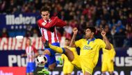 Atletico Madrid's French forward Antoine Griezmann (L) vies with Las Palmas' defender Aythami Artiles during the Spanish Copa del Rey (King's Cup) round of 16 second leg football match Club Atletico de Madrid vs UD Las Palmas at the Vicente Calderon stadi