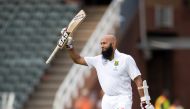 South Africa's Hashim Amla celebrates scoring a century. (REUTERS/James Oatway)