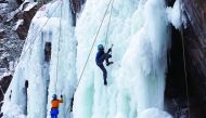 Participants compete in a regional ice climbing and winter rock climbing championship at the 