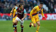 West Ham United's English midfielder Mark Noble runs away from Crystal Palace's English defender Joel Ward (R) during the English Premier League football match between West Ham United and Crystal Palace at The London Stadium, in east London on January 14,