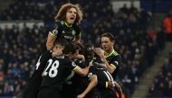 Chelsea's Spanish midfielder Pedro (R) celebrates with teammates after scoring their third goal during the English Premier League football match between Leicester City and Chelsea at King Power Stadium in Leicester, central England on January 14, 2017.  A