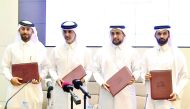 Officials of Qatar University, Qatar Football Association, Aspire Zone, and Supreme Committee for Delivery and Legacy during the MoU signing ceremony.