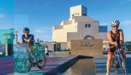 Athletes posing near the iconic Museum of Islamic Art (MIA) in this file picture. The inaugural Doha Triathlon will be held at the MIA on Friday.