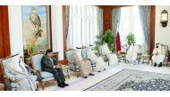 Emir H H Sheikh Tamim bin Hamad Al Thani with Organization of Islamic Cooperation Humanitarian Fund's (OICHF) delegation at Emiri Diwan, yesterday.