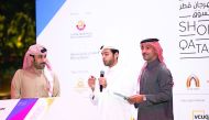Qatari social media influencer, Abdulaziz Al Ajeel, announces the winners as Hamad Al Khaja of QTA (right) and Jassim Al Kuwari of the Ministry of Economy and Commerce look on during the second weekly raffle draw at Mall of Qatar.
