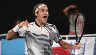 Switzerland's Roger Federer celebrates his victory against Japan's Kei Nishikori during their men's singles fourth round match on day seven of the Australian Open tennis tournament in Melbourne on January 22, 2017. AFP / SAEED KHAN 

