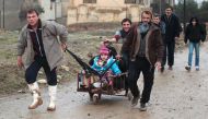 Iraqi families flee an area near Mosul controlled by Islamic State group on January 22, 2017 (AFP Photo/AHMAD AL-RUBAYE).