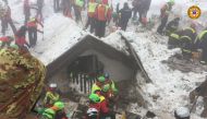 A handout picture released on January 23, 2017 by the Corpo Nazionale Soccorso Alpino e Speleologico (CNSAS) shows rescue teams working at the avalanche-hit Hotel Rigopiano, near the village of Farindola, on the eastern lower slopes of the Gran Sasso moun