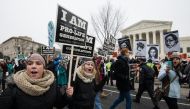 Anti-abortion demonstrators march past the US Supreme Court in Washington, DC, on January 22, 2016 (AFP / Nicholas Kamm) 
