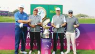 Members of the winning team, Ernie Els, Rachid Aki, Chawki Harb and Matthew Moucharafleh pose for a photograph at the Doha Golf Club yesterday.  