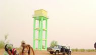 Villagers collecting water from a water project built by Qatar Charity in Mauritania.