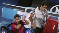 Switzerland's Stan Wawrinka applauds next to Switzerland's Roger Federer as they leave the court after their Men's singles semi-final match. (REUTERS/Jason Reed)