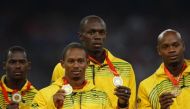 Gold medalists (L - R) Nesta Carter, Michael Frater, Usain Bolt, Asafa Powell of Jamaica pose during the medal ceremony for the men's 4 x 100m relay final of the athletics competition in the National Stadium at the Beijing 2008 Olympic Games August 23, 20