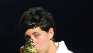 Carla Suarez Navarro of Spain celebrates her victory in the 2016 edition of the Qatar Total Open in Doha.