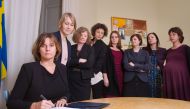 Swedish Environment Minister and Deputy Prime Minister Isabella Lovin (L) signs a referral of Swedish climate law, binding all future governments to net zero emissions by 2045 at the ministry in Stockholm on February 1, 2017. The bill signing was witnesse