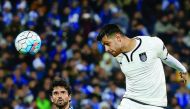 Qatar's Al Sadd player Morteza Pouraliganji (right) heads the ball in front of Leandro Padovani of Iran's Esteghlal during their AFC Champions League play-off match at the Azadi Stadium in Tehran, yesterday.