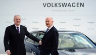 This file photo taken on April 23, 2012 shows Volkswagen CEO Martin Winterkorn (L) and Chairman of the supervisory board of Volkswagen Ferdinand Piech posing at an Audi A3 electric car during a signing ceremony and a visit to the Volkswagen plant in Wolfs