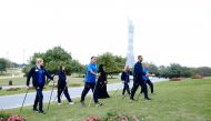 People practice Nordic Walking at Aspire Zone. 