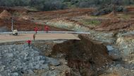 California Department of Water Resources crews inspect and evaluate the erosion just below the Lake Oroville Emergency Spillway site after lake levels receded, in Oroville, California, U.S., February 13, 2017. Kelly M. Grow/ California Department of Water