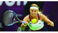 Dominika Cibulkova of Slovakia hits a return to  Russia's Anastasia Pavlyuchenkova during their Qatar Total Open second round match at the Khalifa International Tennis Complex in Doha yesterday. Cibulkova stormed into the quarterfinals with a 7-5, 2-6, 6-